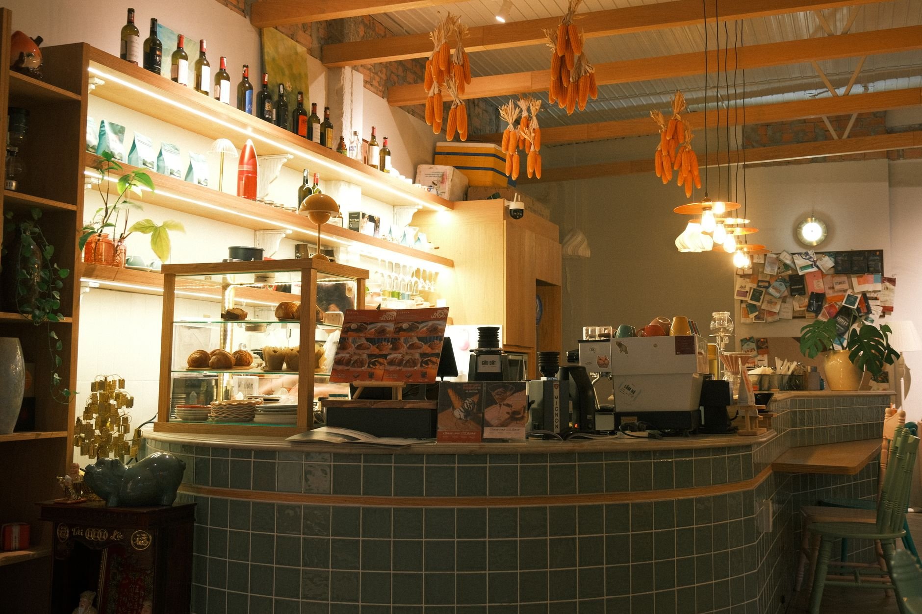 Inviting coffee shop interior with pastries and warm ambient lighting, offering a cozy atmosphere.